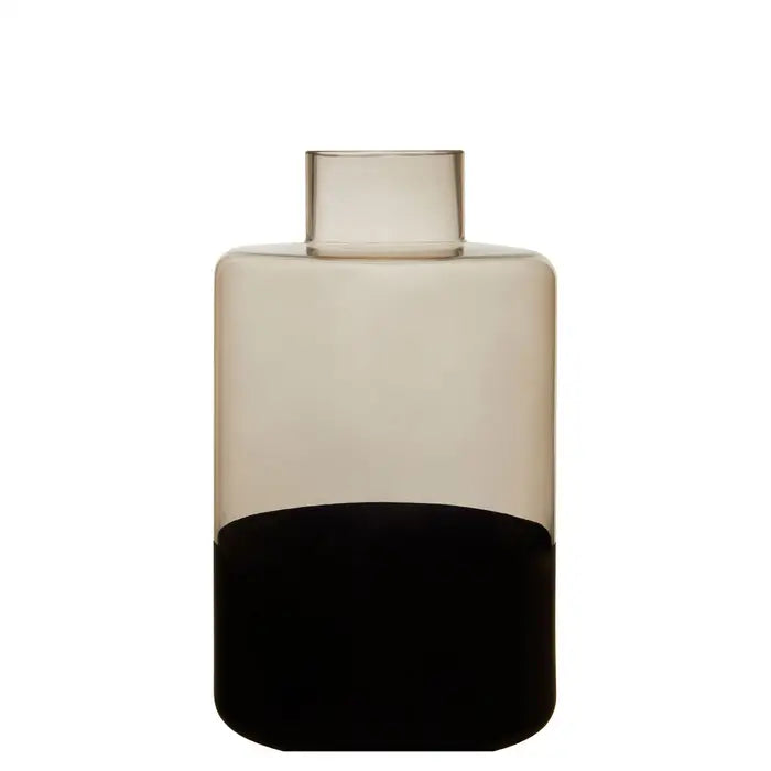 The COVA large vase with narrow bottle neck, has a smoked top that creates a shaded effect. Set against a black base.