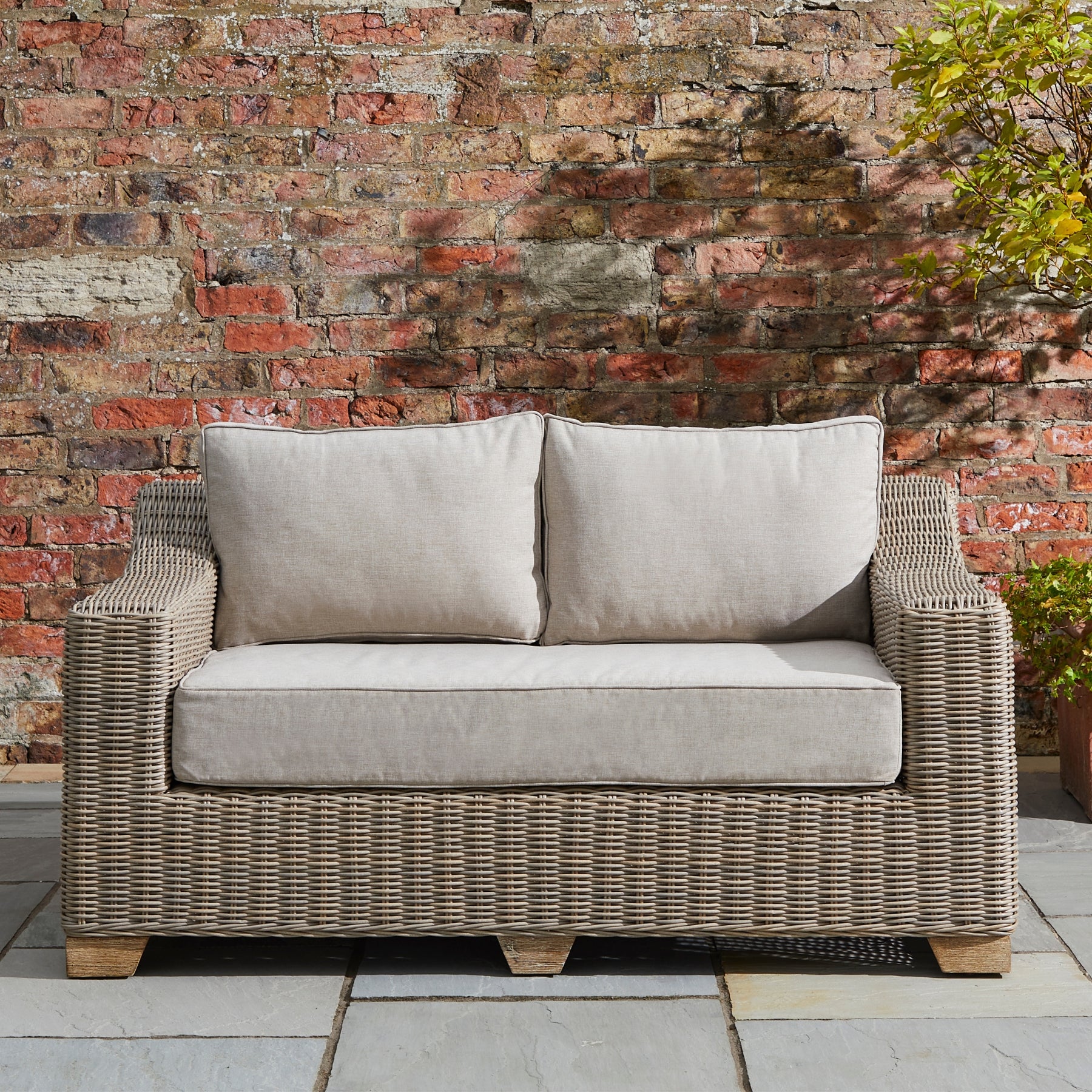 outdoor wicker two seater sofa