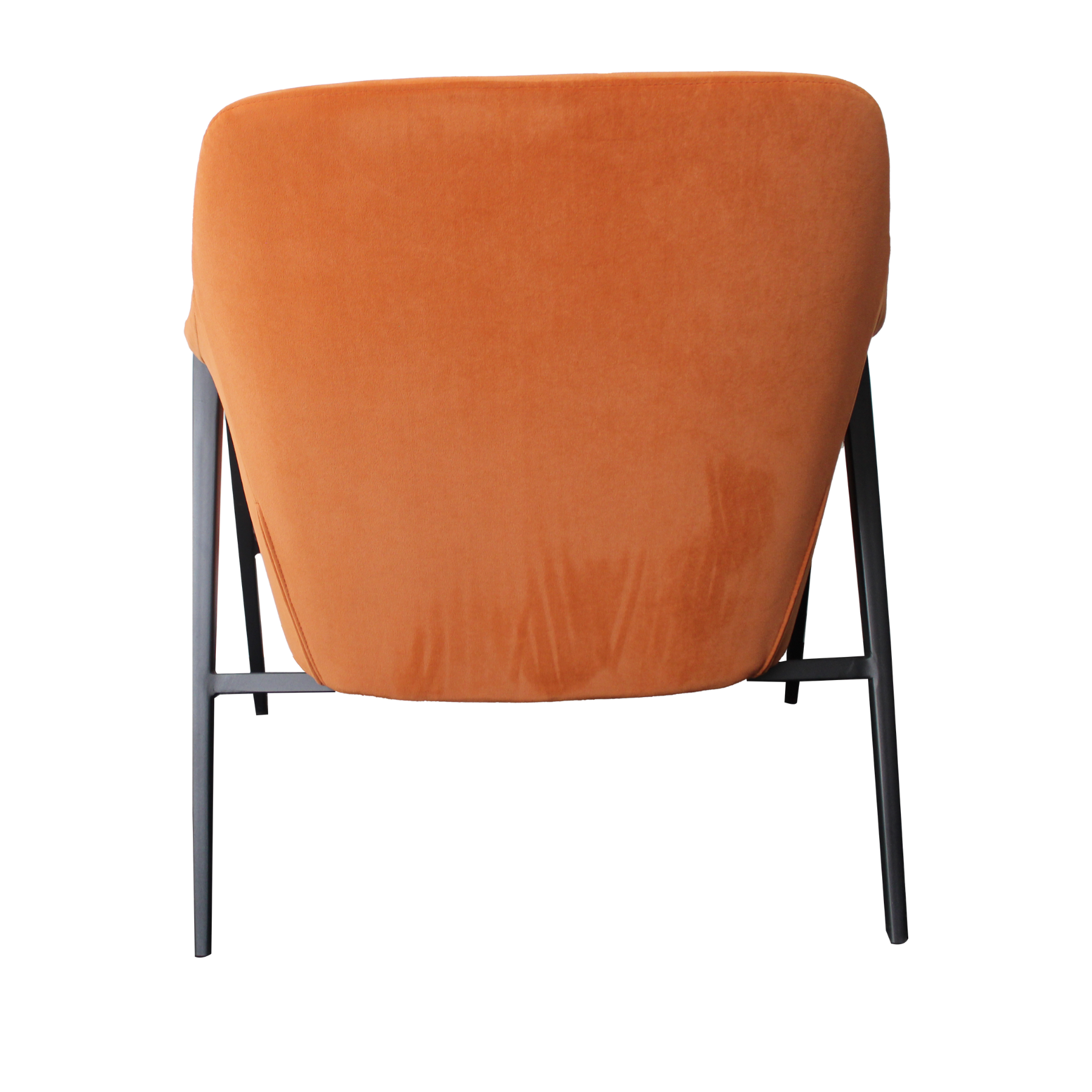 Armchair upholstered in rich burnt orange velvet. Features a black powder-coated metal frame base and legs.  