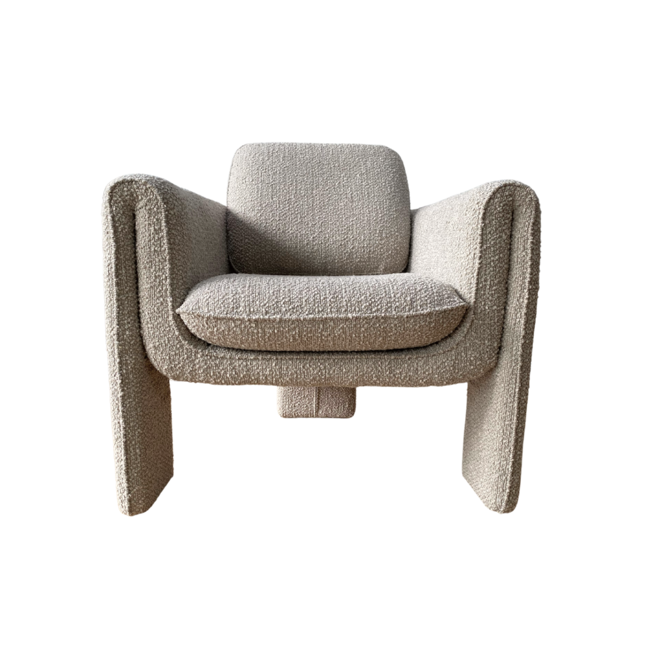 The Monica Armchair has a unique blend of curved and angular structure in a soft boucle upholstered fabric with an art deco design