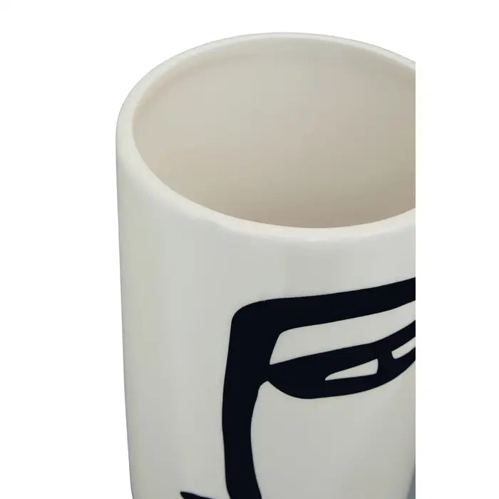 Fabia black and white large face vase - rom robust ceramic, and finished in a white hue, this large vase features an abstract face drawing.