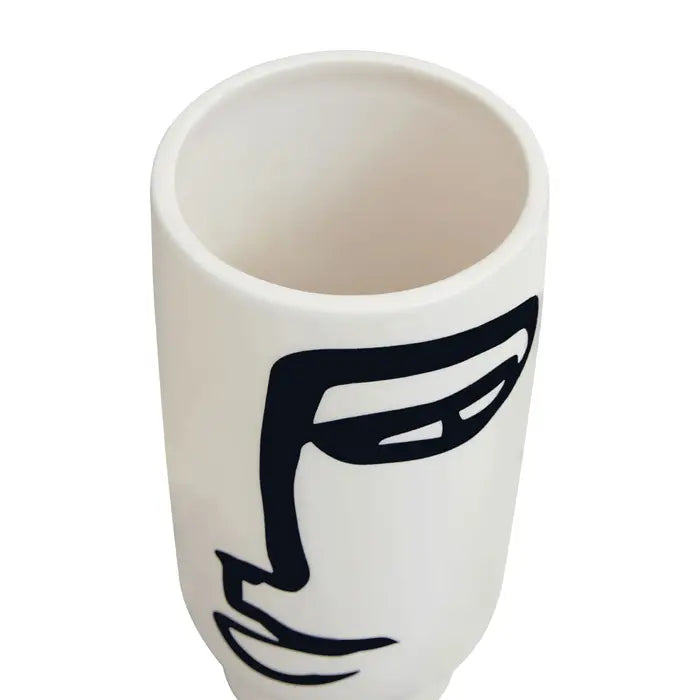 Fabia black and white small face vase - rom robust ceramic, and finished in a white hue, this small vase features an abstract face drawing.