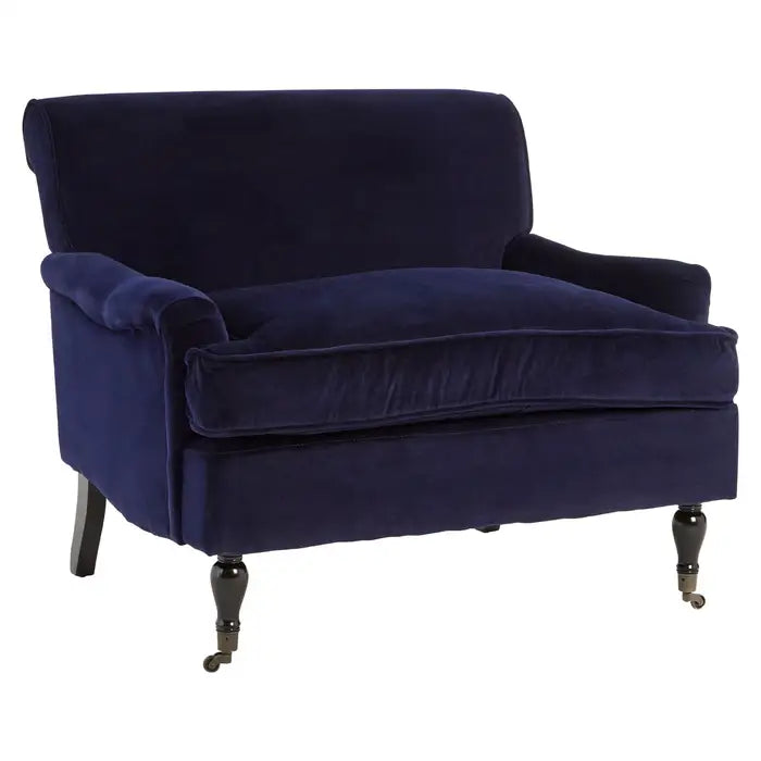 Midnight blue plush velvet armchair with birchwood carved legs