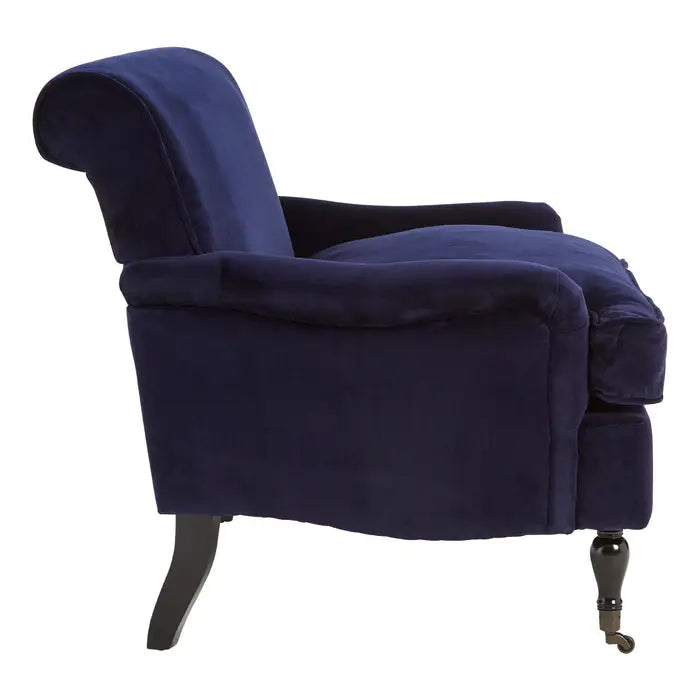 Side view Midnight blue plush velvet armchair with birchwood carved legs