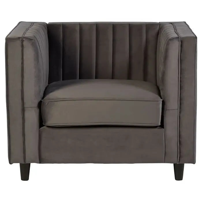 The Farah chair- grey velvet armchair with boxy square shape, pleated armrests and wooden feet