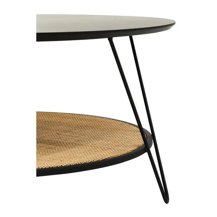 This coffee table has a natural rattan storage shelf with black metal top and black metal hairpin legs