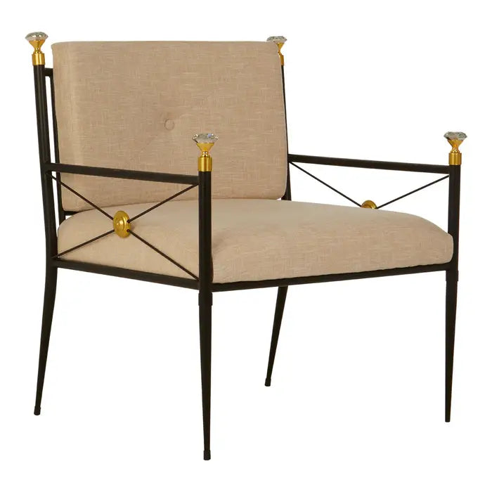 The Monroe Chair - beige upholstered chair with black metal frame and tapered legs and finished with gold diamanté tips on the arms 