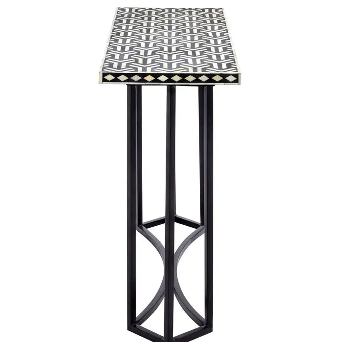 Side view - BOHO console table made of sheesham wood, a rectangular top with a black and white bone inlay pattern,cutout black tiles and a diamond pattern on the sides.