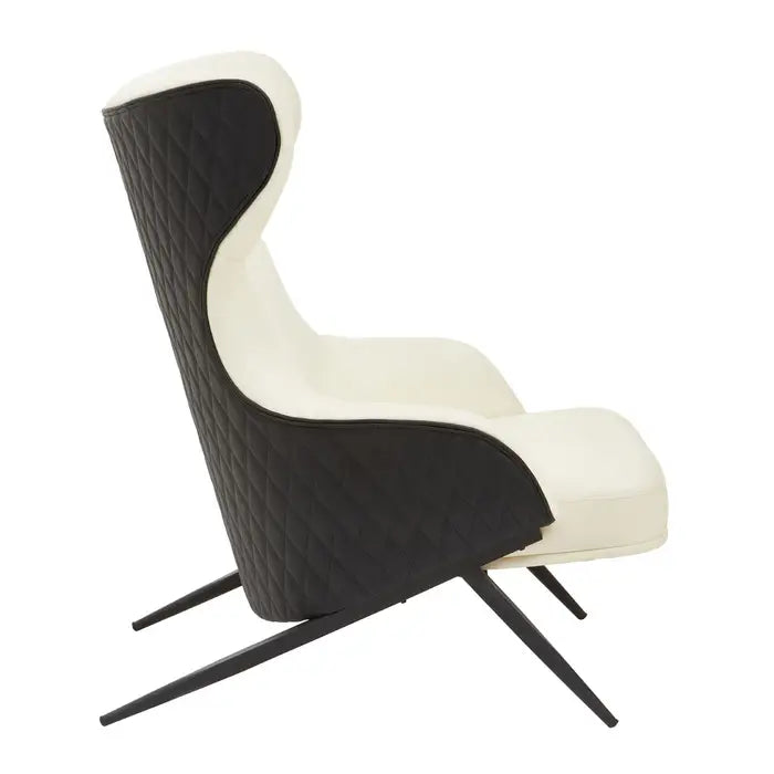 Side View - The Kiev Armchair -Ivory wingback chair features a curved backseat and armrests with a padded seat, supported by angled black metal legs