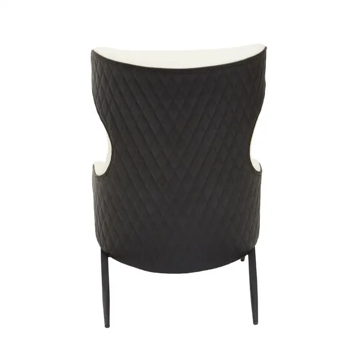 Back View- The Kiev Armchair -Ivory wingback chair features a curved backseat, with black contrast back and armrests with a padded seat, supported by angled black metal legs