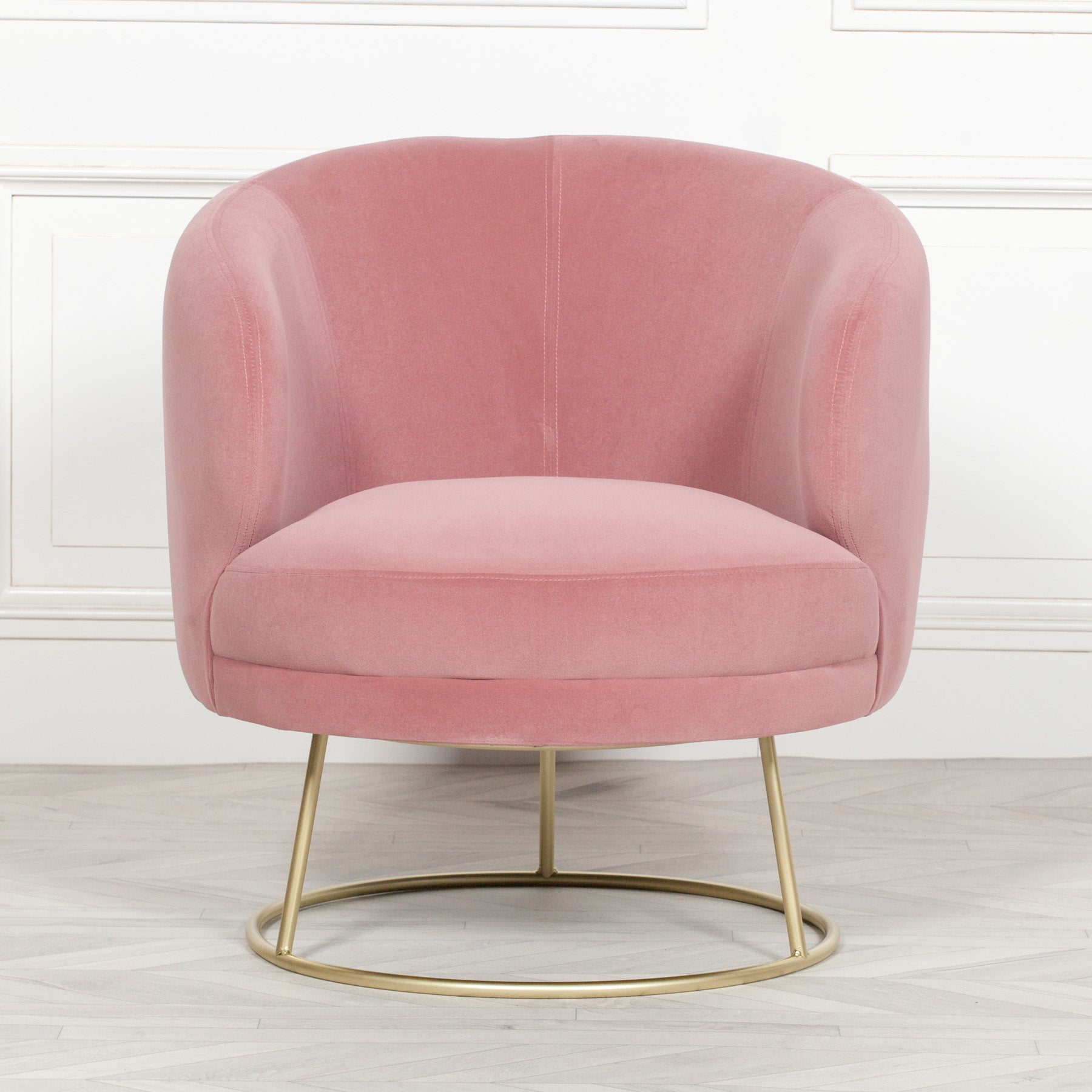 pink PLUSH DECO ACCENT CHAIR is upholstered with luxurious velvet fabric, and designed with a contemporary art deco style and gold plated legs